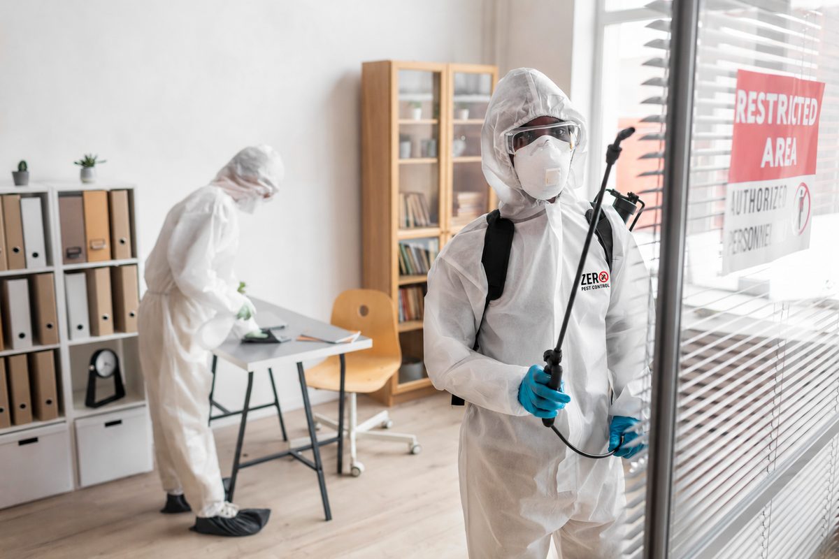 Zero Pest Control technicians treating a commercial office